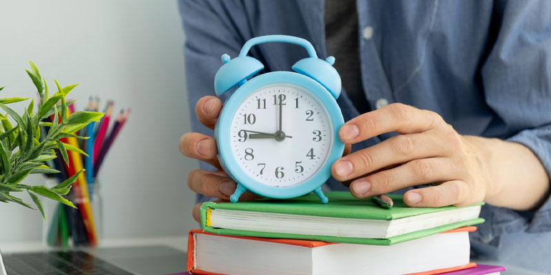 Clock on stack of books