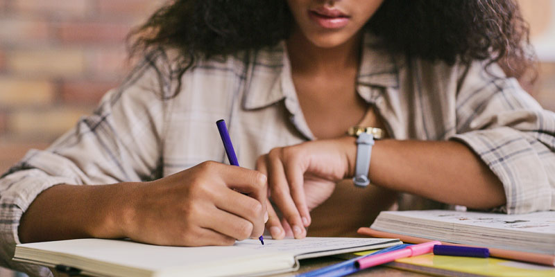 woman working on planner